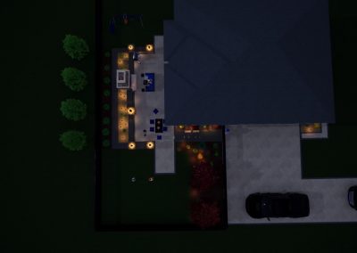 Aerial night view of a house with a lit backyard patio, professional landscaping by Solid Brick Contracting, driveway, two cars, and surrounding trees.